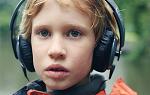Image of young boy wearing headphones